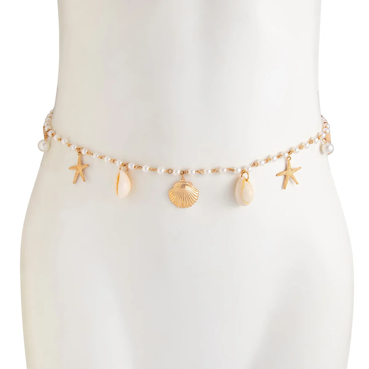 Pearl belly chain on mannequin with starfish and shell charms, gold-tone drops