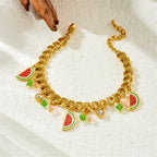 Watermelon enamel charm necklace with gold-tone chain, red-green pendants, and clear sparkle beads