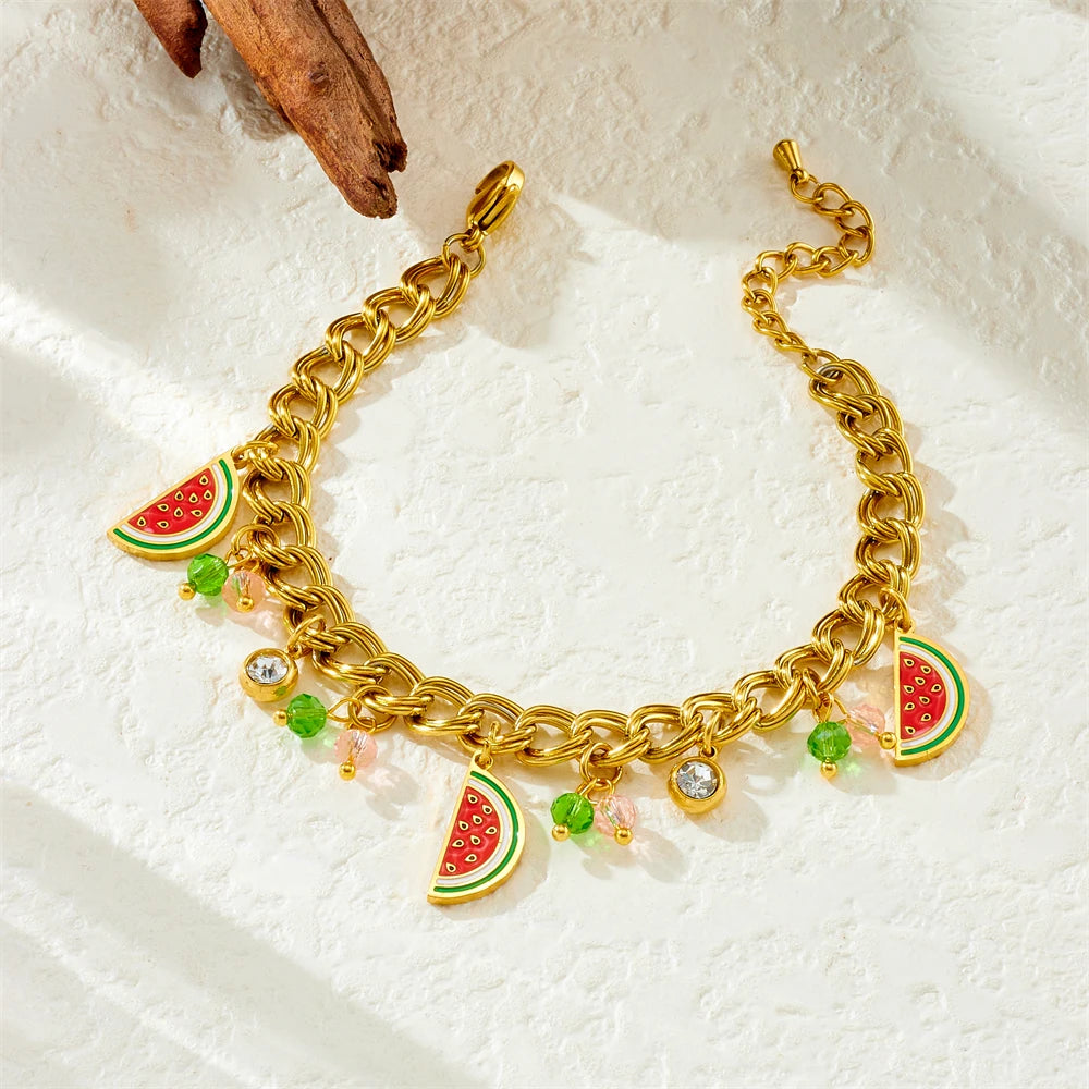 Watermelon enamel charm necklace with gold-tone chain, red-green pendants, and clear sparkle beads