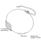 Silver-tone Virgin Mary bracelet with oval medal pendant and cross charm on chain