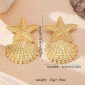 Gold starfish and shell drop earrings, beaded star top and scallop fan base