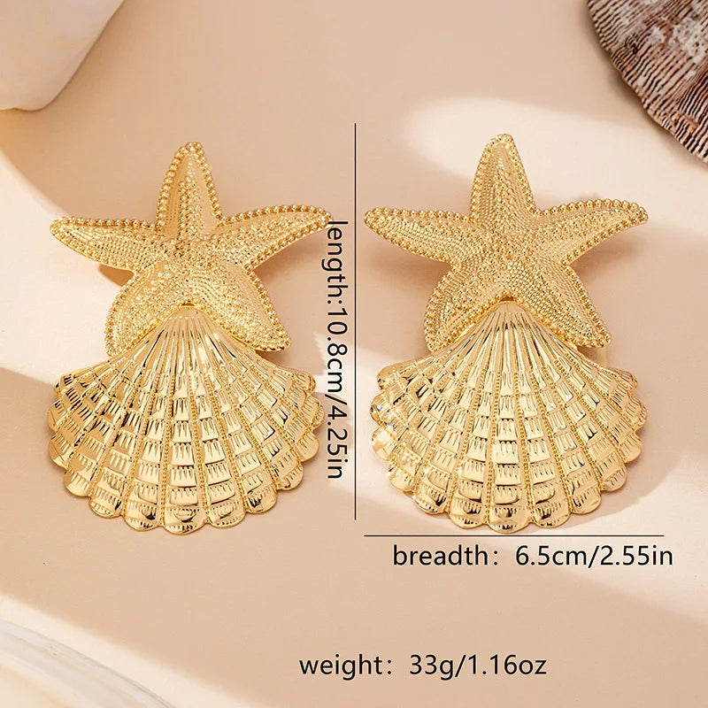 Gold starfish and shell drop earrings, beaded star top and scallop fan base