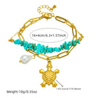 Turquoise beaded double-layer necklace with gold turtle charm and pearl, shown flat