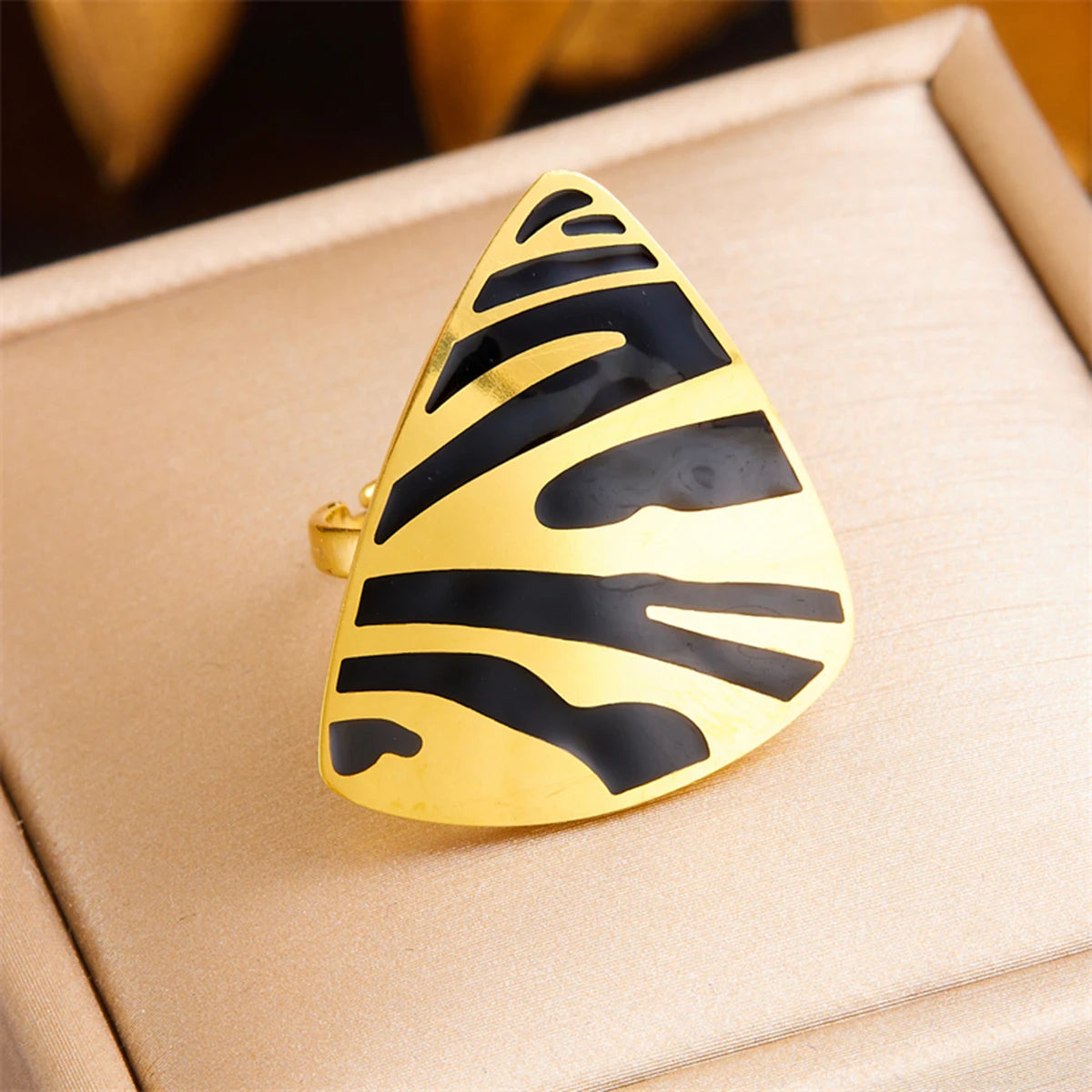 Tiger stripe teardrop ring, white enamel with black stripes and gold-tone outline