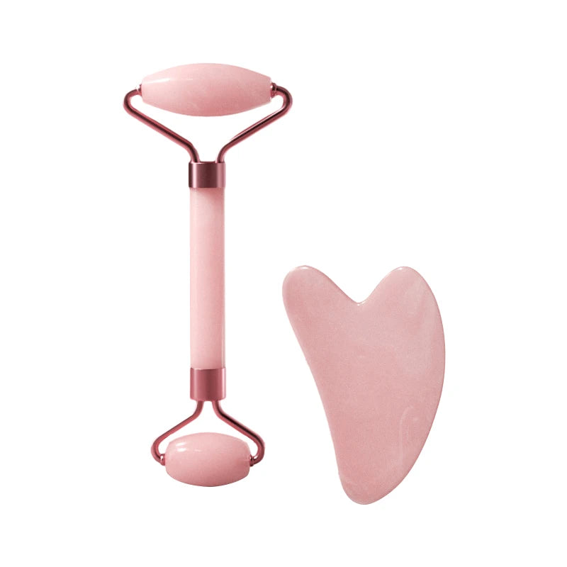Facial massage roller set with pink heart-shaped scraper and rounded base roller