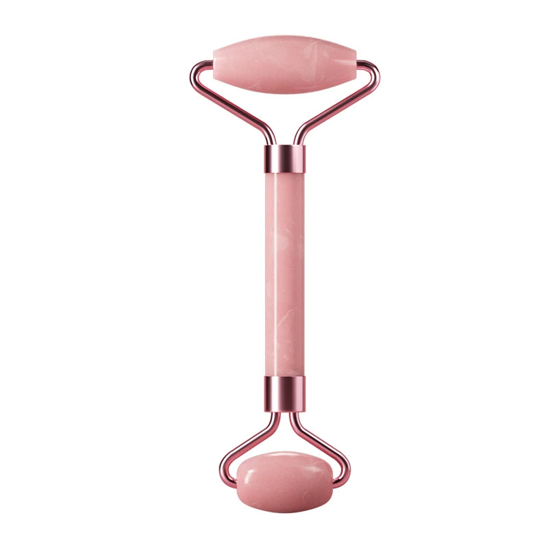 Facial massage roller with pink handle, oval top stone plate, and rounded base roller