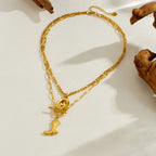 Gold-tone long pendant necklace with cowboy hat and boot charms