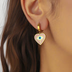 Gold-tone heart dangle earring with pink evil eye enamel and turquoise center