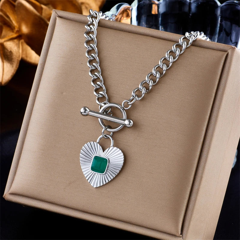 Silver-tone heart pendant necklace with green square stone heart charm and curb chain