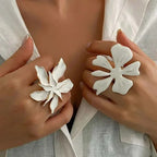 White flower adjustable ring with white petals and gold-tone beaded center