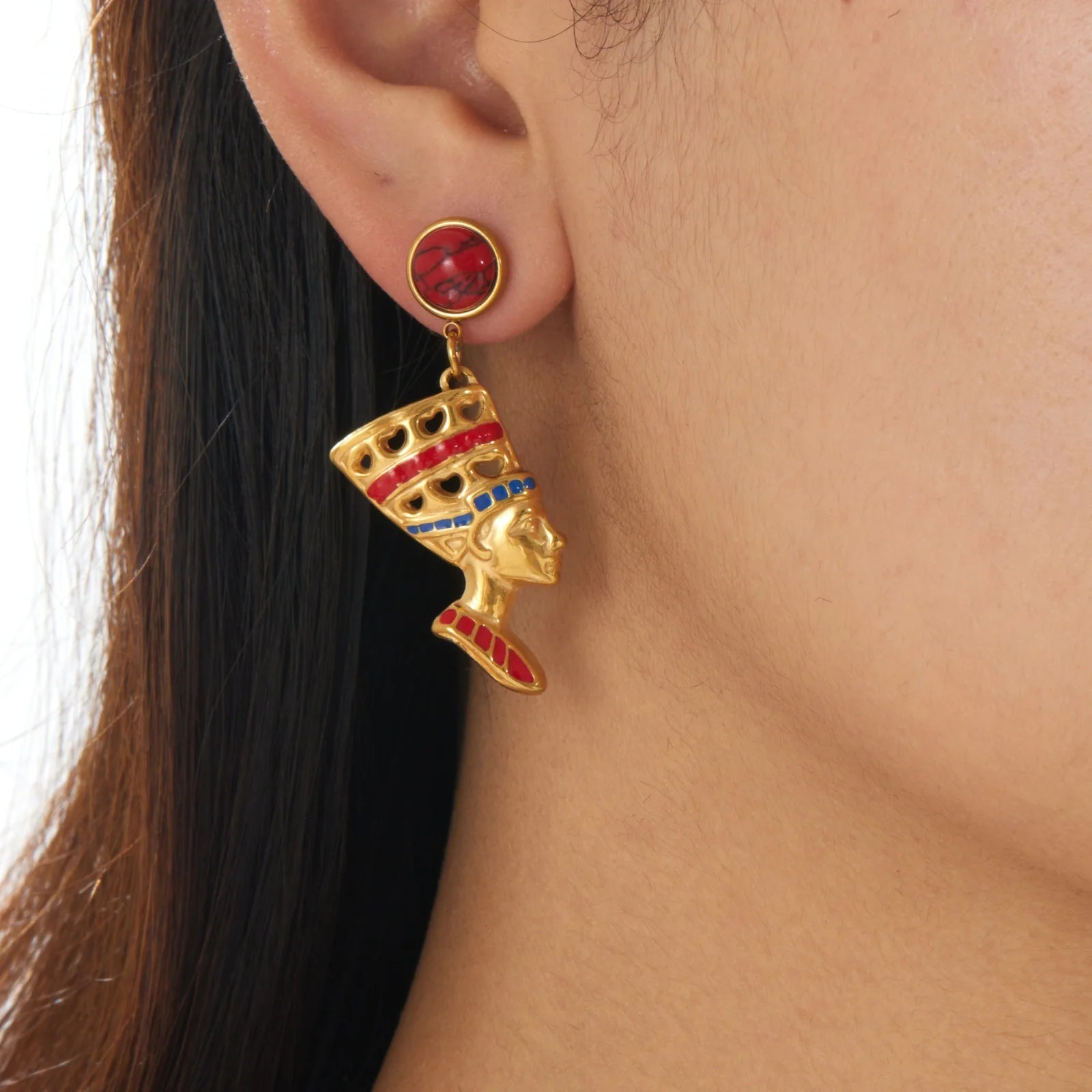 Gold-tone stud earrings with red round cabochon and dangling queen head
