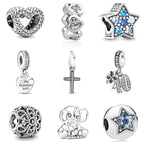 Sterling silver charm bead assortment with heart, cross, star, and elephant designs