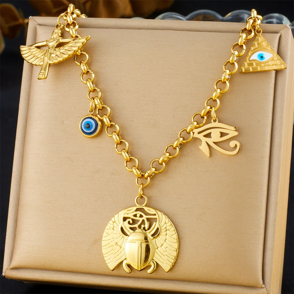 Gold-tone multi-pendant necklace with turquoise accents and eye, wing, and angel charms