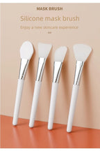 Silicone face mask brush set of four, angled white handles with silver ferrules and silicone heads
