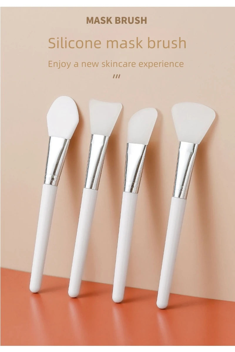 Silicone face mask brush set of four, angled white handles with silver ferrules and silicone heads
