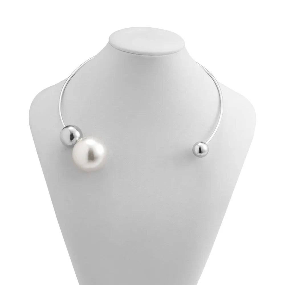 Silver-tone collar necklace with two white pearl beads and small silver end caps