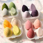 4-piece makeup sponge set with green, dark purple, yellow, and pink teardrop sponges
