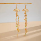 Boucles d'oreilles pendantes bohème à pompons — Étoile de mer et coquillage