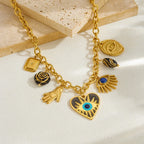 Gold evil-eye hamsa charm bracelet with blue eye heart, hamsa hand, and eye pendant