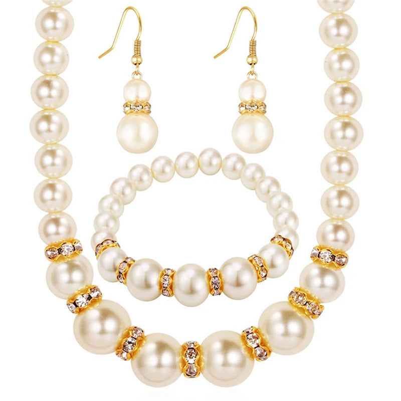 Pearl bridal set with pearl necklace, pearl bracelet, and dangling pearl earrings