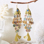 Koi charm drop earrings with gold-tone blue eye and iridescent bead tassels.