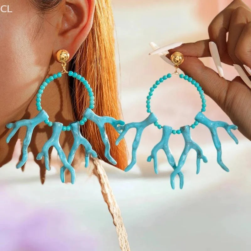 Turquoise acrylic drop earrings with round bead hoops and long coral-like fringe