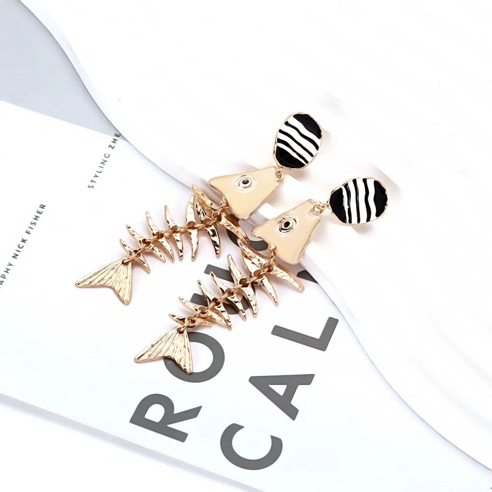 Gold-tone fishbone dangle earrings set with black-and-white striped round tops