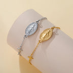 Two-tone pendant bracelets with oval Virgin Mary medallions and cross charm accents