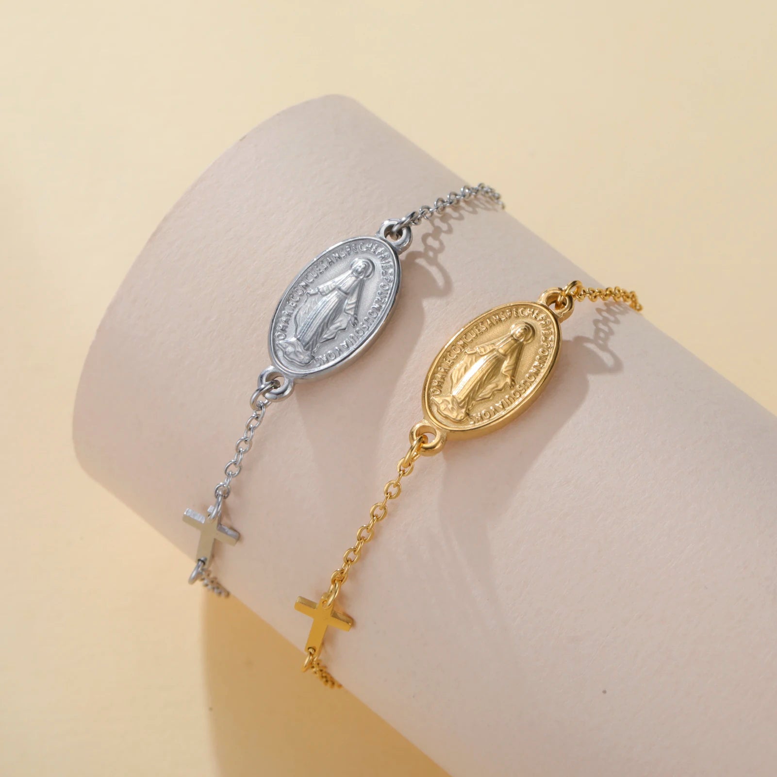 Two-tone pendant bracelets with oval Virgin Mary medallions and cross charm accents