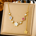 Gold-tone flower pearl necklace with five-petal charms and white pearl beads