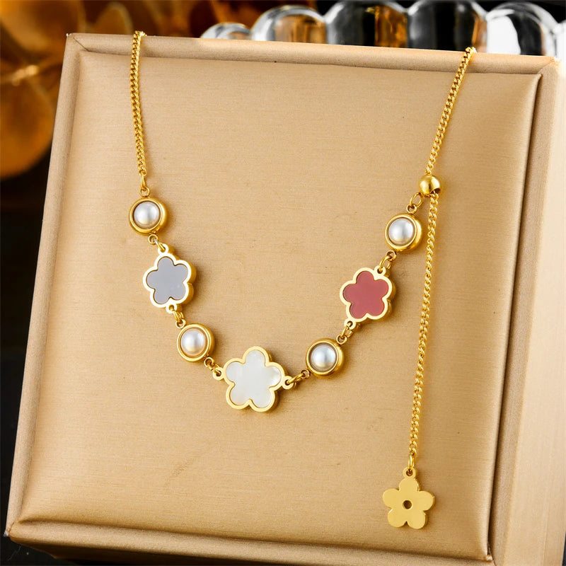 Gold-tone flower pearl necklace with five-petal charms and white pearl beads