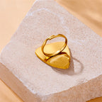 Gold-tone teardrop cuff ring with white tiger stripe inlay