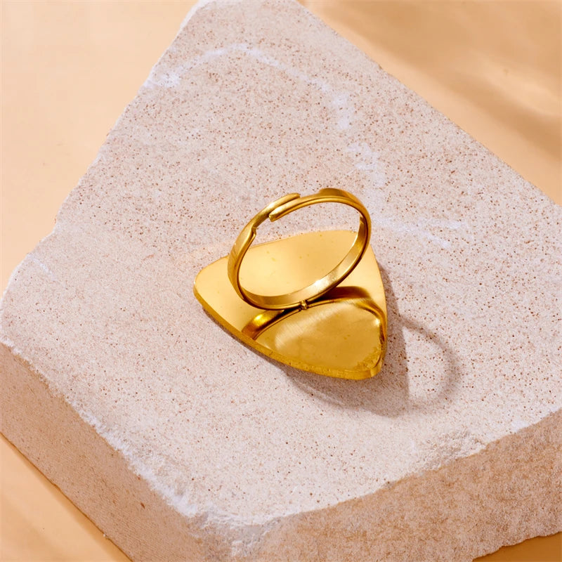 Gold-tone teardrop cuff ring with white tiger stripe inlay