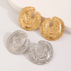 Textured crescent drop earrings in gold and silver, hollow center design