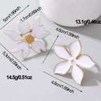 White flower adjustable ring set with white petals and gold-tone beaded center