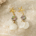 Gold starfish earrings with rainbow shell bead and layered white petal dangles