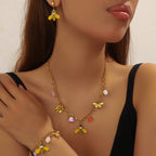 Gold-tone bee and flower necklace with pearl charms and dangling bee earrings