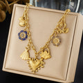 Gold-tone multi-pendant necklace display with heart, tassel, bow, and blue flower charms