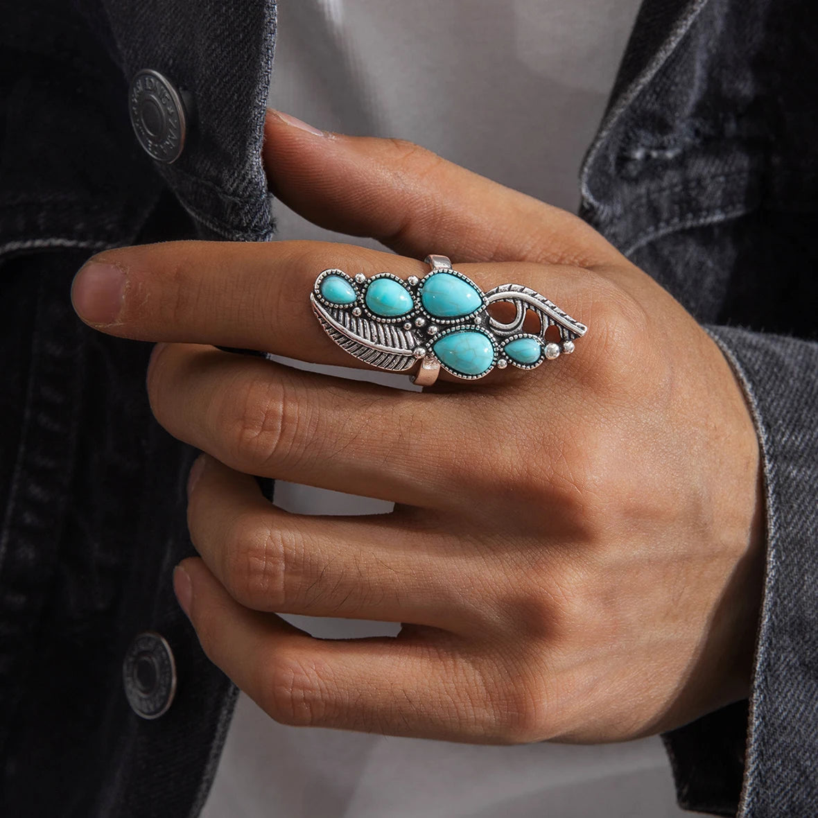 Turquoise boho stone ring with feather motif and silver-tone metal detailing