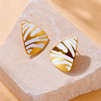 Tiger stripe enamel teardrop earrings with gold-tone trim and black and white stripes