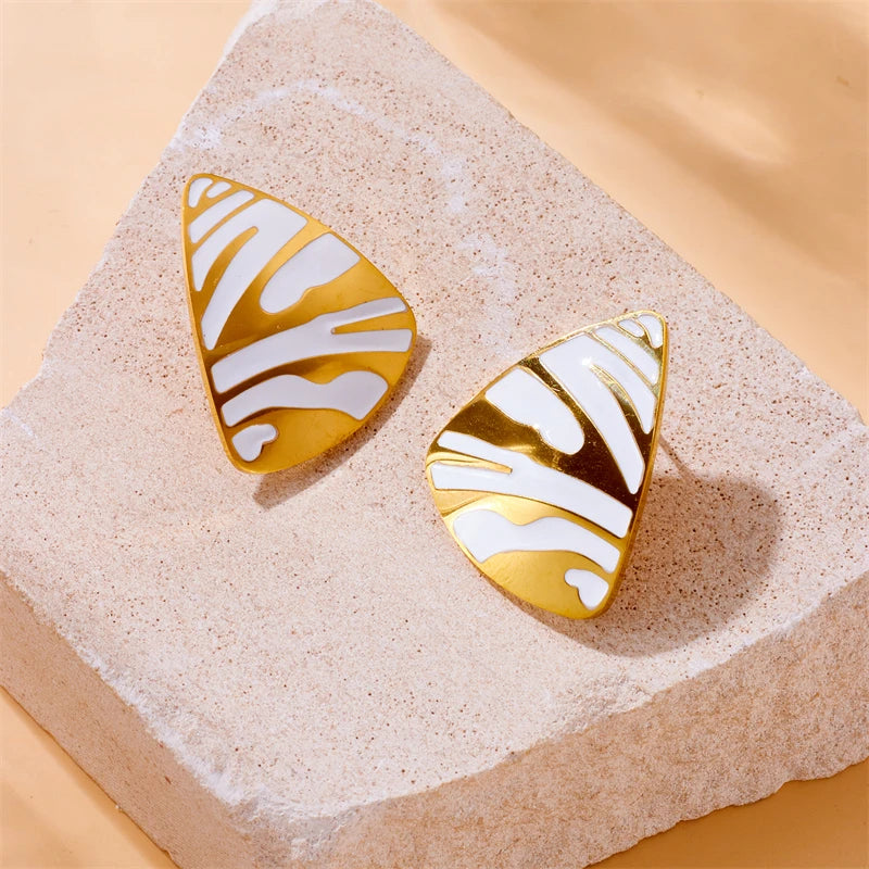 Tiger stripe enamel teardrop earrings with gold-tone trim and black and white stripes