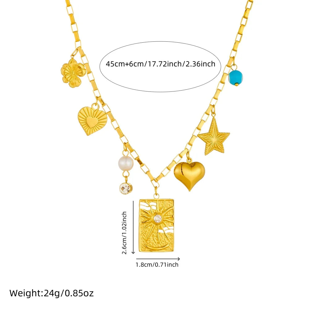 Gold-tone multi-charm necklace with square pendant, heart charm, star charm and evil-eye bead