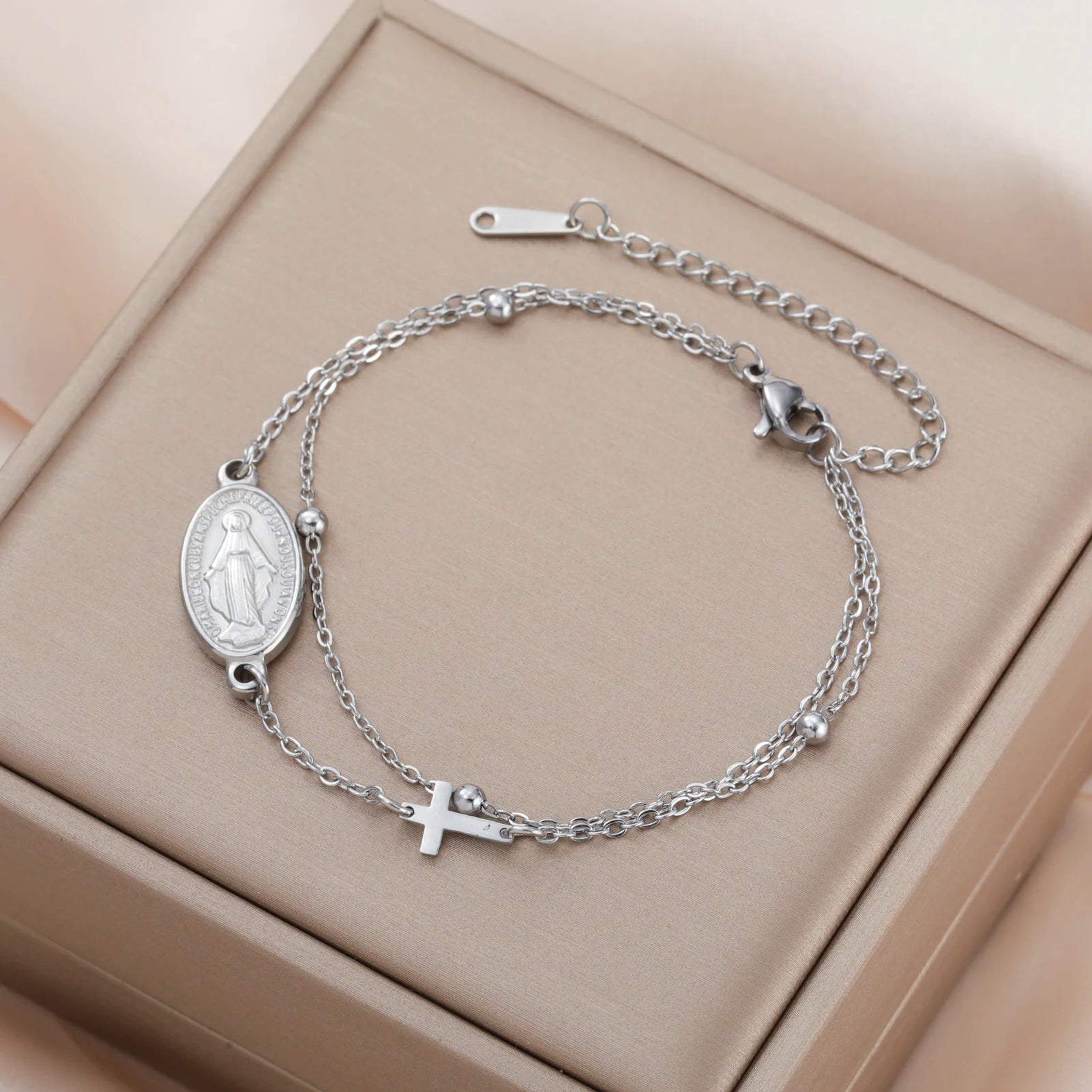 Silver-tone oval pendant bracelet with Virgin Mary medallion and cross charm on chain