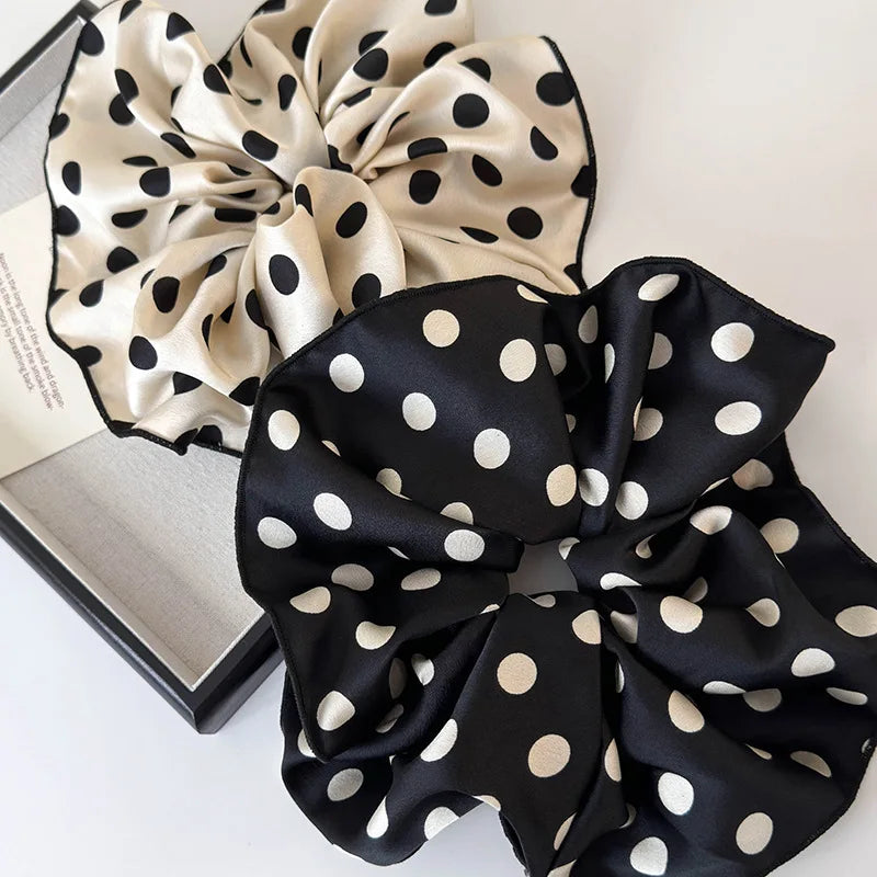 Polka dot scrunchie set with black and white fabric bows and elastic gathers