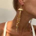 Boucles d'oreilles pendantes bohème à pompons — Étoile de mer et coquillage