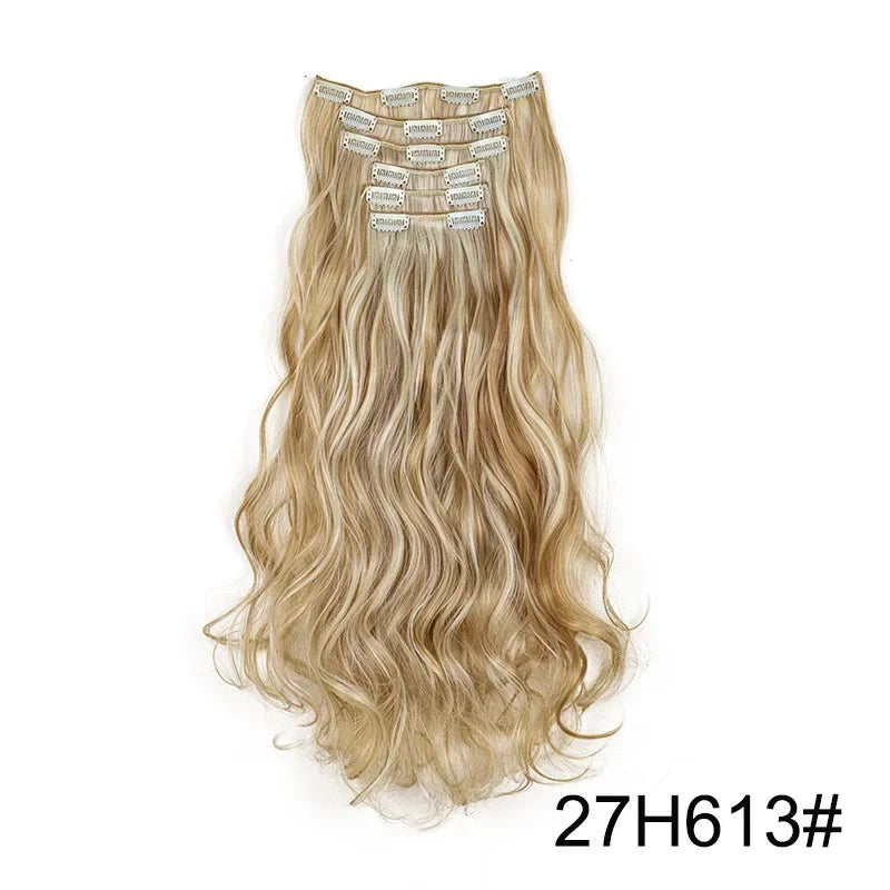 Golden blonde wavy clip-in hair extension with metal comb clips at the top