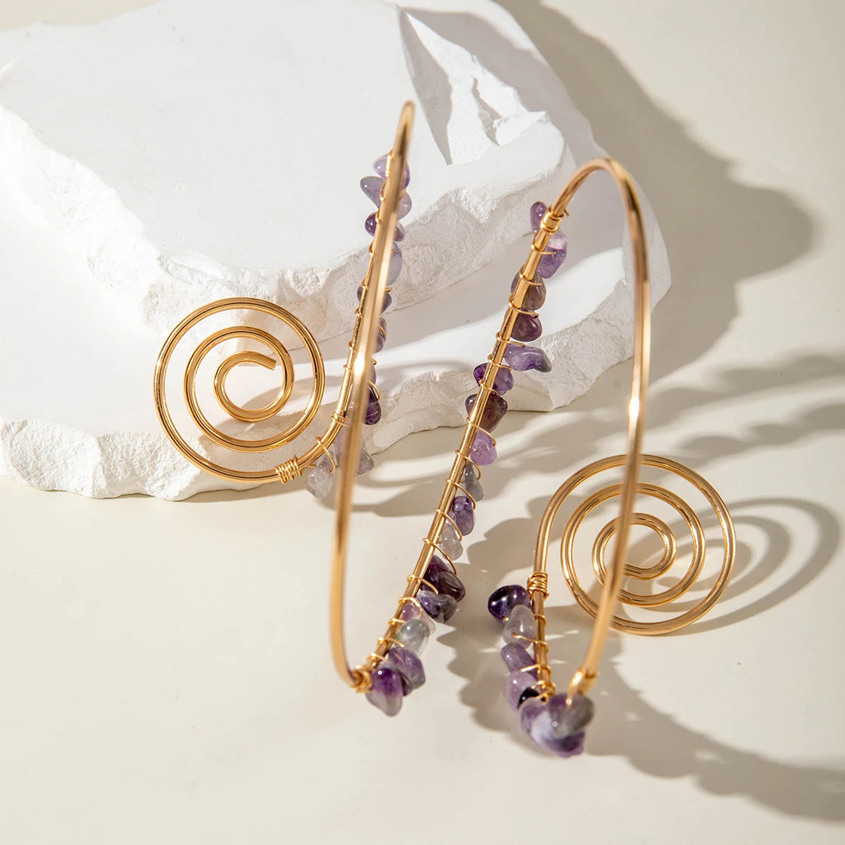 Gold-tone upper arm bracelets with spiral charm and purple stone bead strands