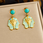 Gold-tone turquoise stud earrings with blue striped pharaoh face drop charms