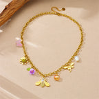Gold-tone bee and flower charm bracelet with pearl and pastel resin dangles