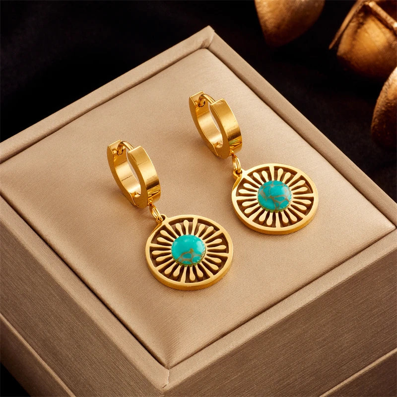 Gold-tone hoop earrings with turquoise eye disc dangles